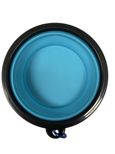 Blue collapsible pet travel bowl with black rim on white background