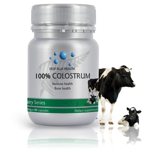 The 100% Colostrum supplement from Deep Blue Health focuses on immune and bone health. The image features a bottle alongside two pasture-raised cows, highlighting natural immune support.